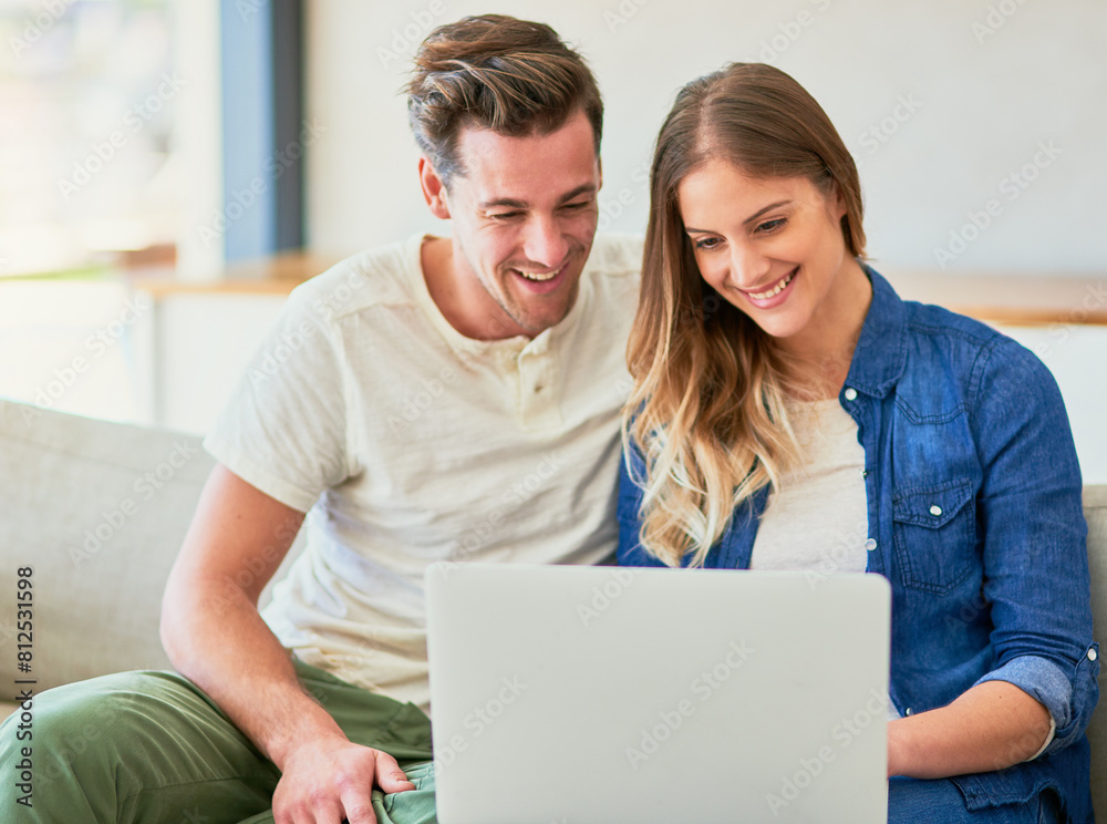 Couple, sofa and online on laptop with happiness for approved application on rental confirmation for new apartment. Man, woman and together in home with internet for streaming comedy shows and movie. Couple, sofa and online on laptop with happiness for approved application on rental confirmation for new apartment. Man, woman and together in home with internet for streaming comedy shows and movie.