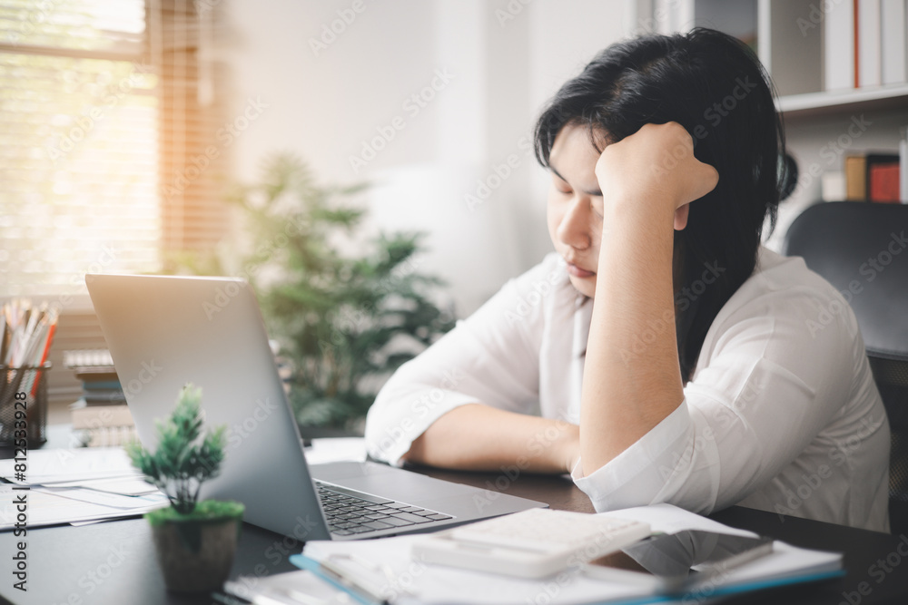 Stressed businesswoman, dealing with the pressures of work and the weight of depression, finds herself struggling in the office, feeling sleepy and overwhelmed by the demands of her job. Stressed businesswoman, dealing with the pressures of work and the weight of depression, finds herself struggling in the office, feeling sleepy and overwhelmed by the demands of her job.
