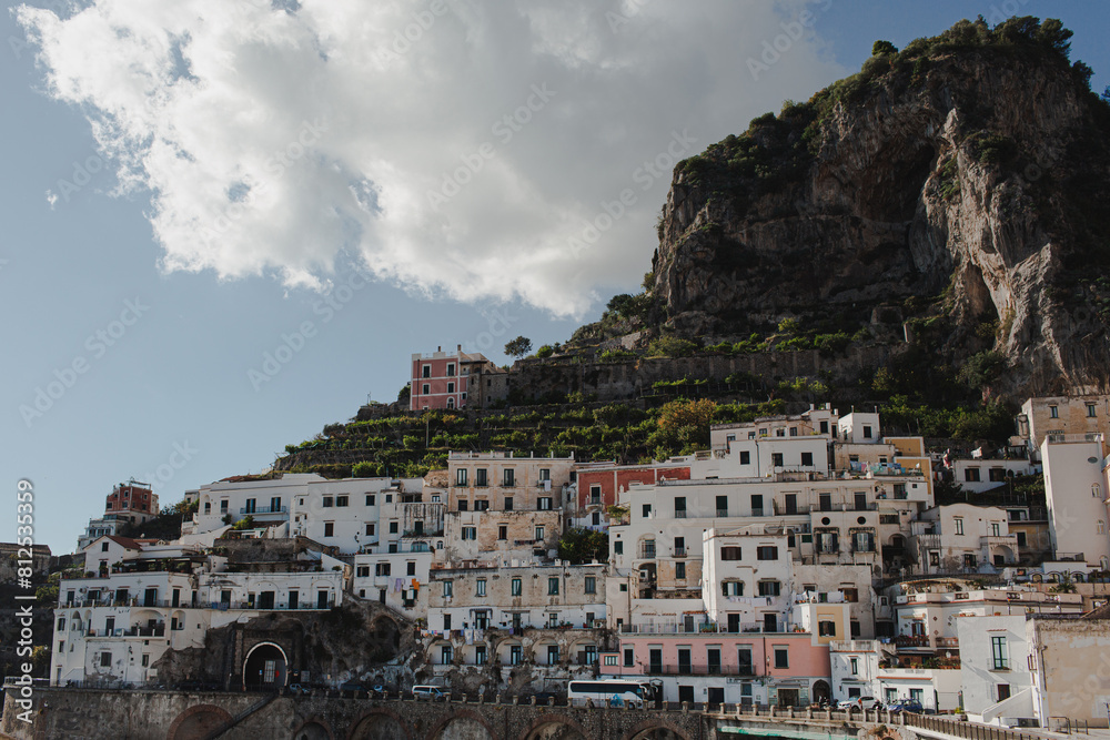 Obraz premium Coastal view of old historic Italian architecture. Traditional European old town buildings in Amalfi, Salerno, Italy. Vacation travel background