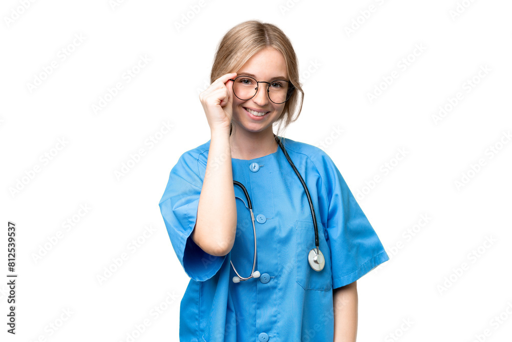 Young nurse English woman over isolated background with glasses and happy Young nurse English woman over isolated background with glasses and happy