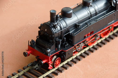 Model of a locomotive on a dark background. © Natalia