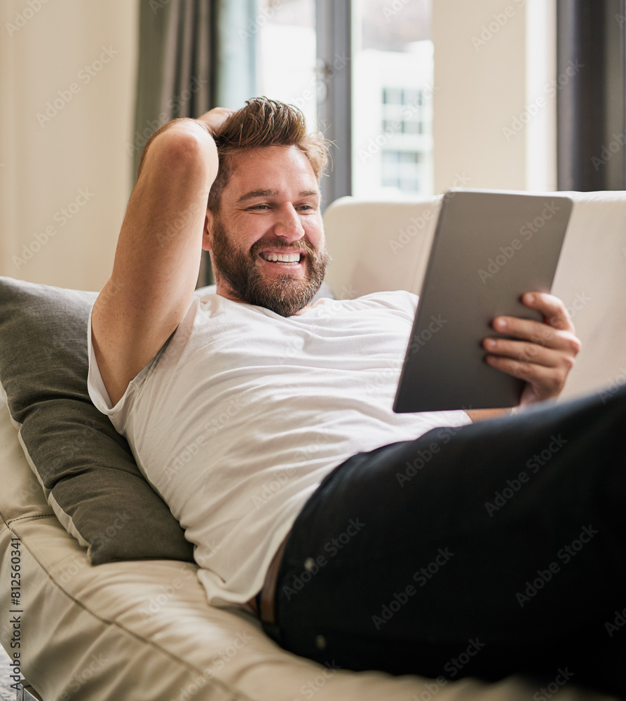 Relax, tablet and man in home, couch and chill for comedy on break, weekend and movie for peace in holiday. Apartment, rest and person with digital, watch and online for funny film with subscription Relax, tablet and man in home, couch and chill for comedy on break, weekend and movie for peace in holiday. Apartment, rest and person with digital, watch and online for funny film with subscription