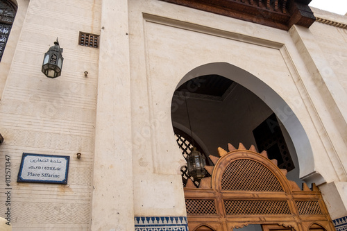 Seffarine square, street name tri lingual, arabic french and berber on ceramics panel. Fez medina old town, door detail of medersa Seffarine.
