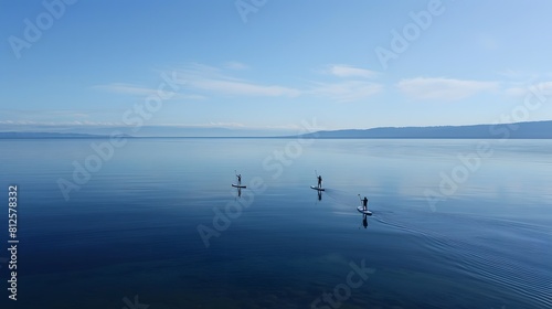 Paddle boarders gliding across the calm waters