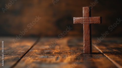 Wooden cross on rustic wooden surface photo