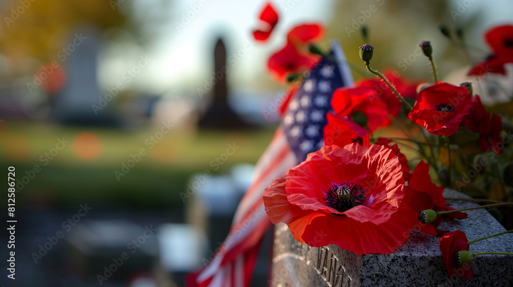 Naklejka premium A close-up of a red poppy and American flag placed in front of a veteran's tombstone with a focus on the engraved name and dates.