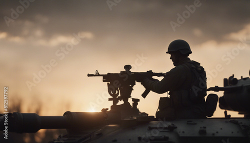silhouette of soldier holding gun on top of tank