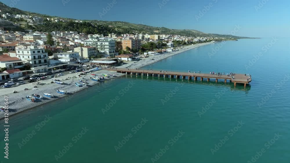 Shot with drone, Orbit around the sea walkway of the Trebisacce coast or beach 2 Shot with drone, Orbit around the sea walkway of the Trebisacce coast or beach 2