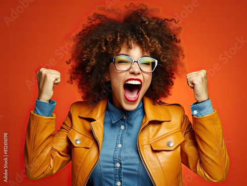 Ecstatic woman shout loud yeah fist up raise win lottery isolated bright shine color background