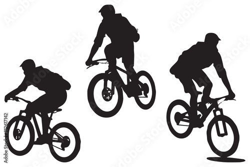 Black silhouettes of bicyclist rider jumping on a white background