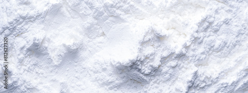 Blurred white flour background. Flour texture. Top view. Copy space.