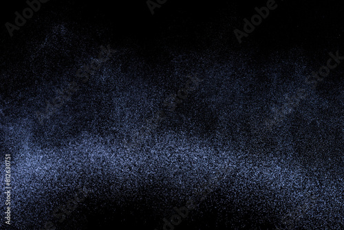Black and blue grunge texture. Abstract splashes of water on dark background. Light clouds overlay texture on black backdrop.