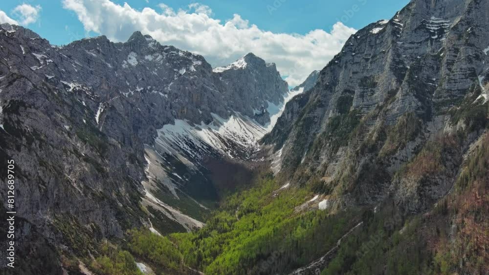 Aerial view of breathtaking peaks and green valley in Julian Alps mountain. Triglav National Park, Slovenia, 4k Aerial view of breathtaking peaks and green valley in Julian Alps mountain. Triglav National Park, Slovenia, 4k