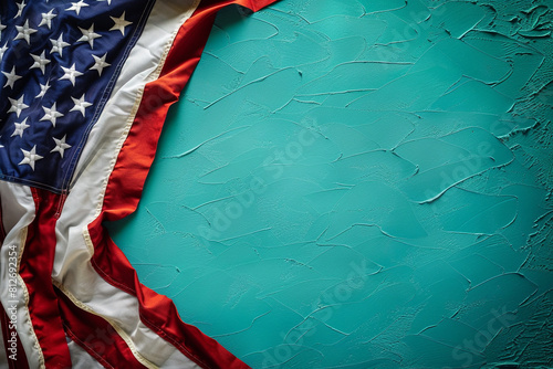 Turquoise backdrop holds the flag of Americ symbolizing Memorial Day reverence. photo