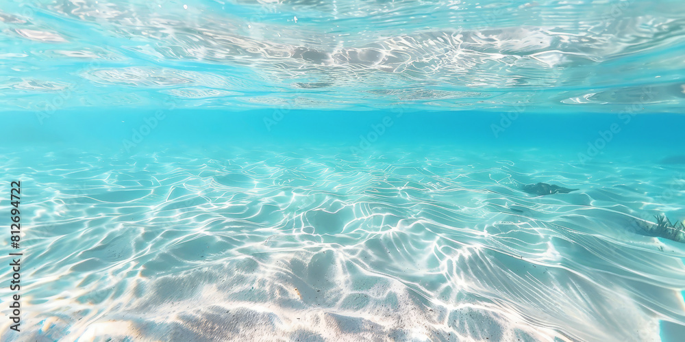 Underwater view of clear blue water, with light ripples and a white background. ocean underwater, beach underwater with white sand