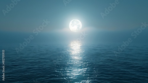 A large moon is reflected in the calm water of the ocean