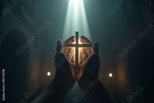 Serene Moment of Worship: Hands Holding a Cross under a Divine Light in a Church photo