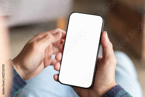 cell phone blank white screen mockup.hand holding texting using mobile on desk at office.background empty space for advertise.work people contact marketing business,technology