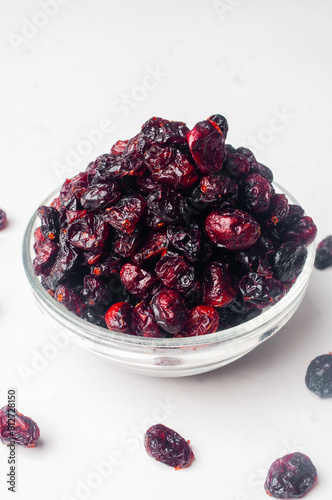 Dried cranberry on white background close up