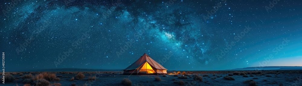 Resting under the vast expanse of a starry night, a solitary tent radiates a feeling of tranquility and privacy, encouraging visitors to detach from the outside world and fully embrace the serenity
