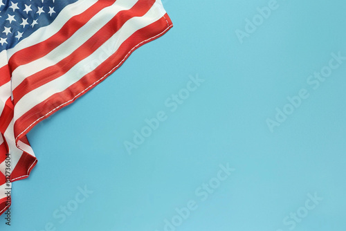 Solemn American flag on cornflower blue, a respectful nod Memorial Day.
