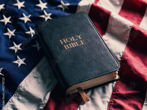 Sacred Union: Christianity and Patriotism Intertwined on the American Flag. Christianity and Patriotism concept. The holy Bible laying on a red white and blue american flag.