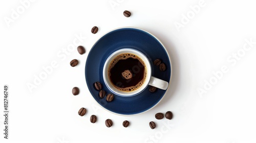 A dark blue cup of coffee on a saucer with coffee beans scattered around it on a white background.