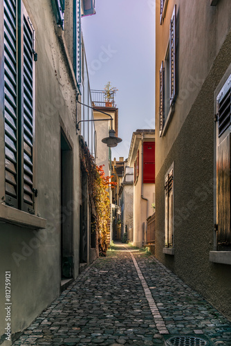 A hidden narrow alley in the center of Zurich old town ("Altstadt") in a spring afternoon