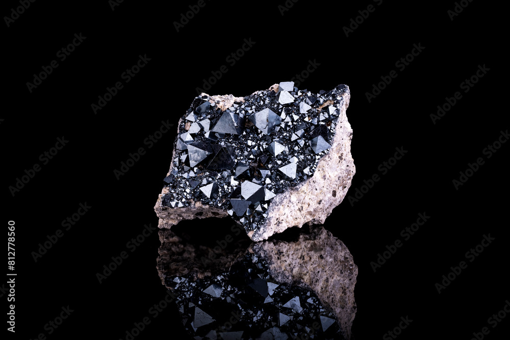 Magnetite crystals on feldspar photography isolated on black blackground. From Cerro Huañaquino, Potosi Department, Bolivia
Magnetite crystals on feldspar photography isolated on black blackground. From Cerro Huañaquino, Potosi Department, Bolivia