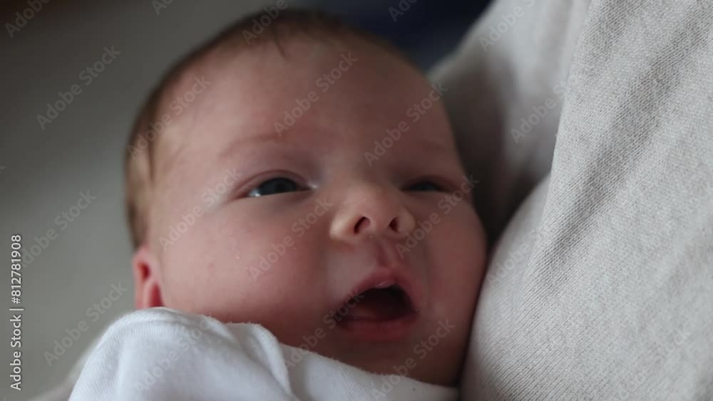 Woman holding a newborn baby in her arms. Woman holding a newborn baby in her arms.