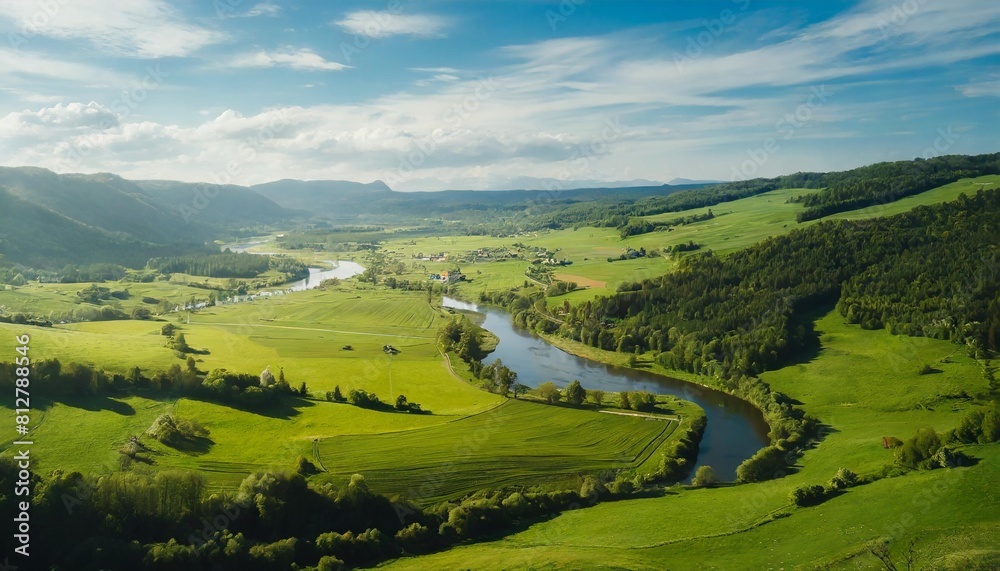 breathtaking countryside with green meadows and river on a summer sunny day