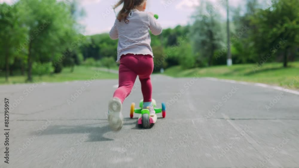 kid Girl Enjoying a Leisurely Stroll with her Scooter kid Girl Enjoying a Leisurely Stroll with her Scooter