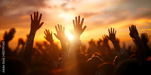People Raising Hands in Worship Silhouetted Against a Sunset Sky. Concept Worship, Silhouette, Sunset, Hands Raised, Spiritual