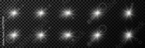  Set of white light effects. Star flares with a glare of light and sparks. On a transparent background.