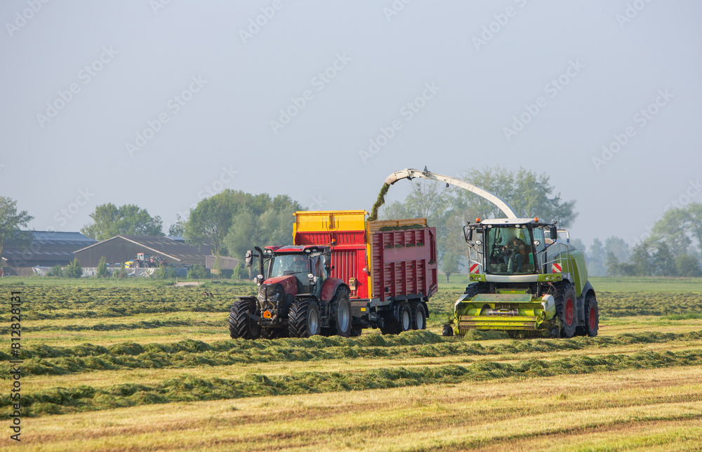 large machines used for grass harvest in spring near Leerdam in holland large machines used for grass harvest in spring near Leerdam in holland