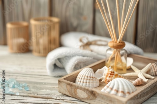 A wooden tray hosting a collection of spa essentials like a scented diffuser and sea shells, set against a wooden backdrop with copy space