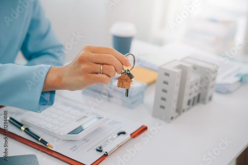 Real estate agent talked about the terms of the home purchase agreement and asked the customer to sign the documents to make the contract legally  Home sales and home insurance concept.