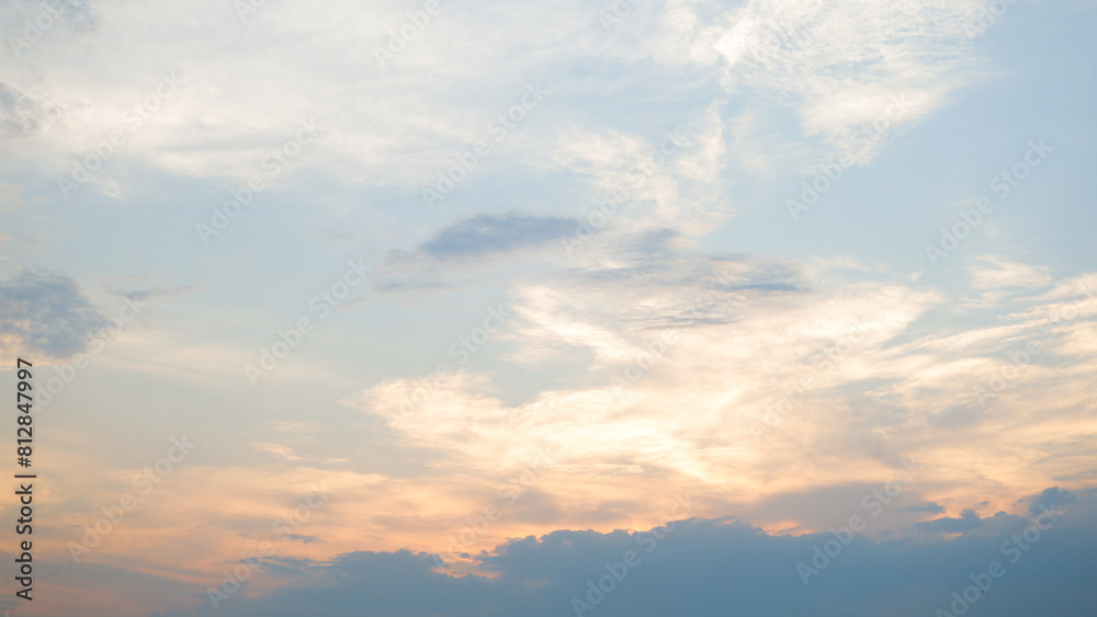 A view of the sunset in the evening that lights up the sky in an orange hue. A view of the sunset in the evening that lights up the sky in an orange hue.