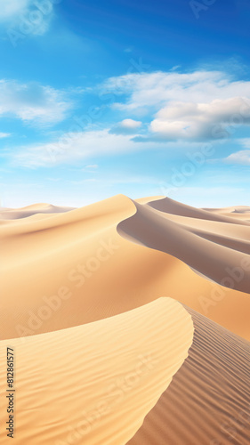 Sand dunes under blue sky with white clouds, peaceful desert landscape