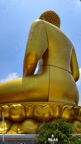 Big Golden Buddha Statue in Wat Pak Nam Phasi Charoen or Pak Nam Temple - It is famous for its large seated Buddha that is the largest in Bangkok Thailand - Travel Sculpture and Architecture Religion 