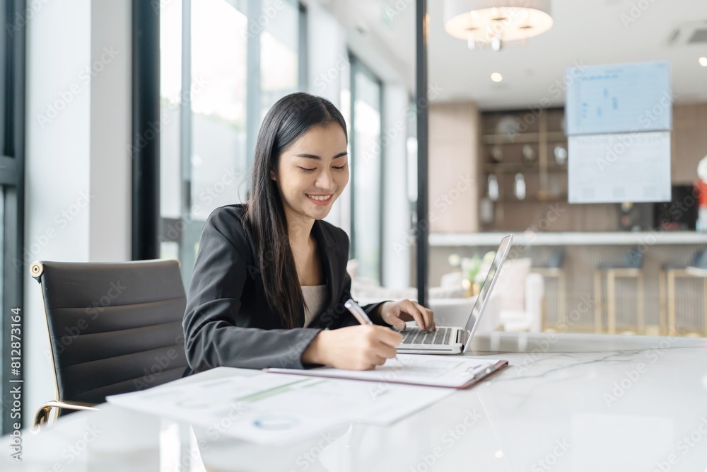 Beautiful confident asian business woman working with laptop Hands typing  keyboard. Professional investor working new start up project. business planning in office. Technology business