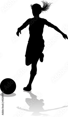 A female soccer football player woman in silhouettes