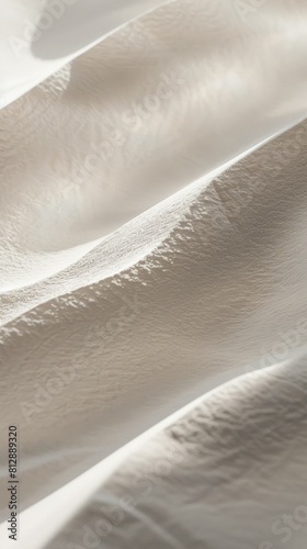 A white fabric with a pattern of sand dunes