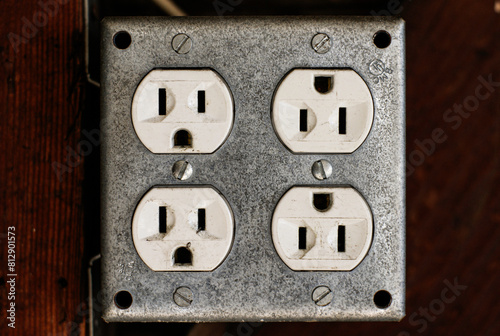 Old electrical wall outlet close-up