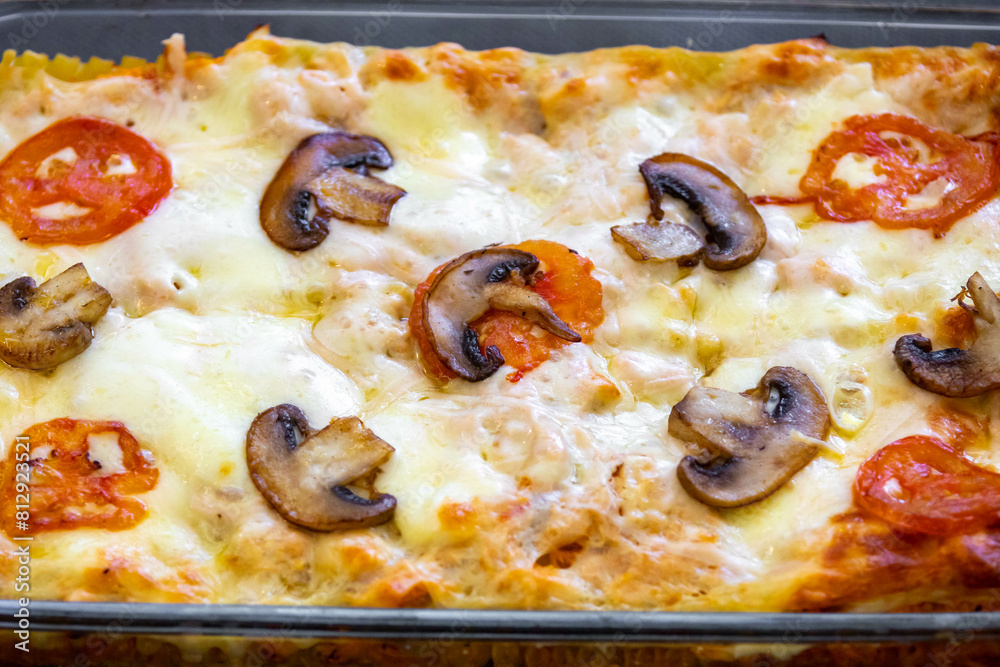 Traditional chicken lasagna with cheese and mushrooms Traditional chicken lasagna with cheese and mushrooms
