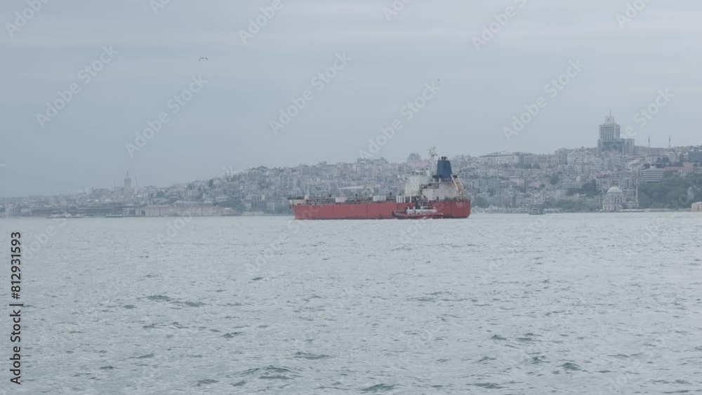 A tanker is passing through the Bosporus Strait in Istanbul. In the background, you can see the old city of Istanbul. A tanker is passing through the Bosporus Strait in Istanbul. In the background, you can see the old city of Istanbul.