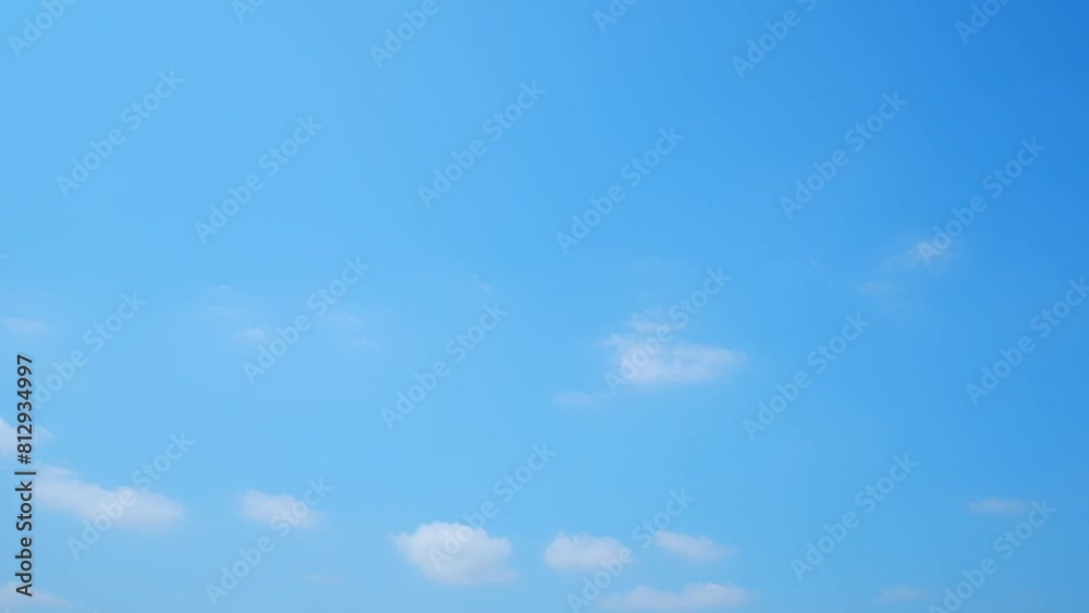 A serene blue sky punctuated with the gentle motion of puffy clouds, in a mesmerizing time lapse, reflects the lightness and purity of a perfect summer atmosphere. Timelapse, cloud background. 4K.
A serene blue sky punctuated with the gentle motion of puffy clouds, in a mesmerizing time lapse, reflects the lightness and purity of a perfect summer atmosphere. Timelapse, cloud background. 4K.