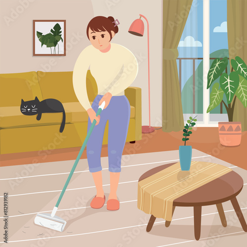 A woman doing housework in the living room.
