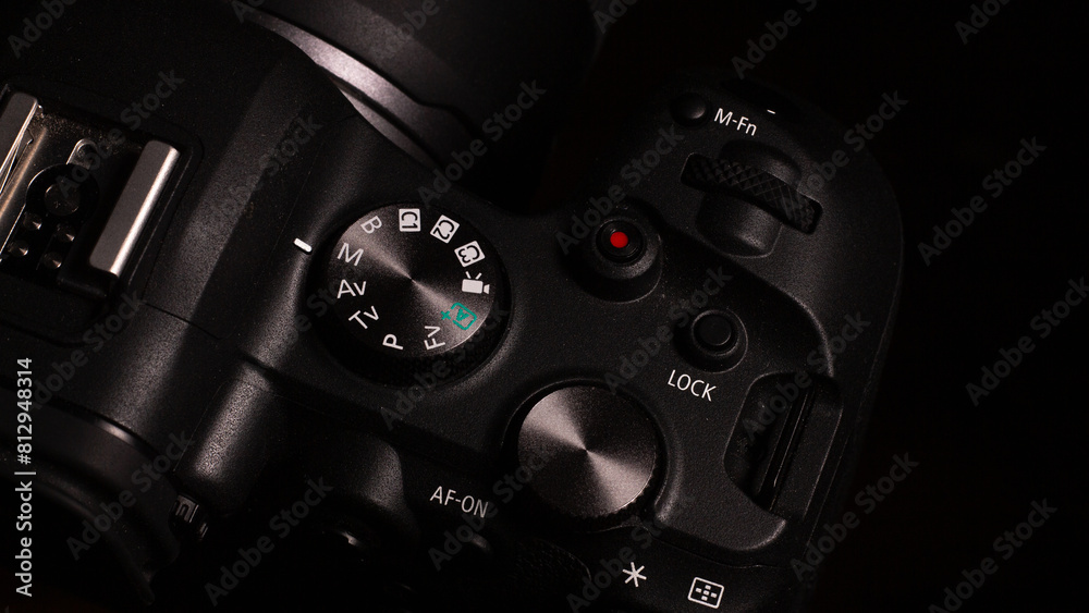 Fototapeta premium Photography shooting modes digital SLR camera with different buttons and roulettes nearby