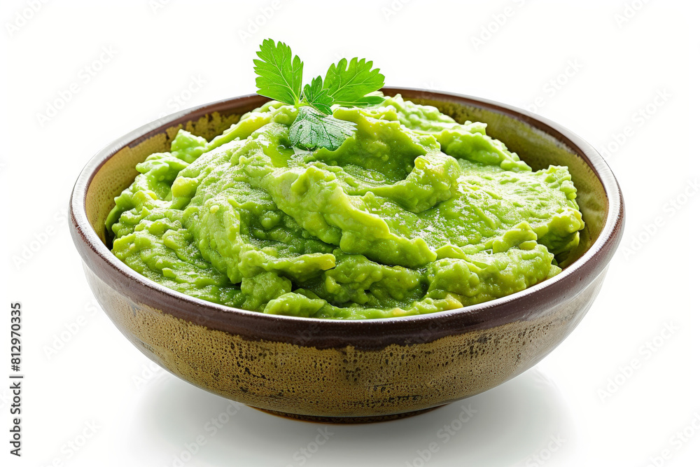 Bowl of creamy avocado guacamole, bright green and textured, isolated on a clean white surface Bowl of creamy avocado guacamole, bright green and textured, isolated on a clean white surface